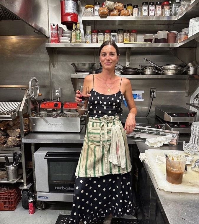 A café owner at work behind the counter